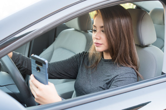 Teen Girl Driving Car While Texting