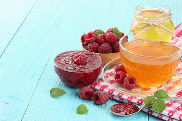 healthy background. raspberry with raspberry jam and honey on blue wooden table