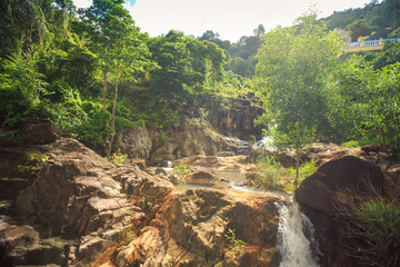 Waterfall Cascade in Tropical Forest by Monastery in Vietnam