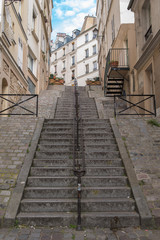 Typical alley in Montmartre, the most romantic staircases in Paris
