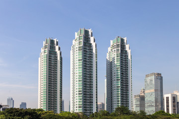 Fototapeta na wymiar Tall luxury residential towers in Jakarta, Indonesia capital city.