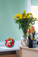 bouquet with yellow flowers lying on table .