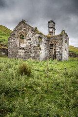 Fototapeta na wymiar The ruins of an old school in the Connemara countryside in Ireland