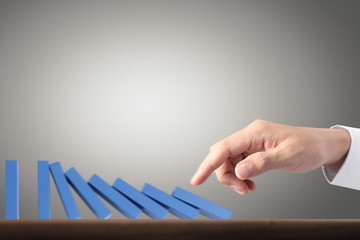 Hand Stopping domino concept