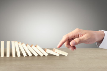 Hand Stopping domino concept