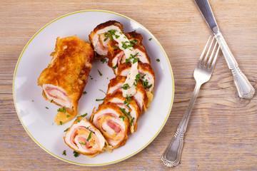 Сhicken breasts with cheese and bacon. Crispy, creamy chicken wraps. View from above, top studio shot, horizontal