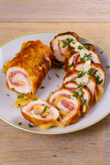 Chicken breasts with cheese and bacon. Crispy, creamy chicken wraps, horizontal