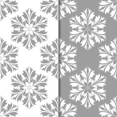 White and gray set of floral backgrounds. Seamless patterns