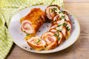 Chicken breasts with cheese and bacon. Crispy, creamy chicken wraps, horizontal