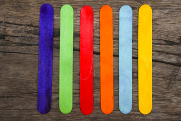 Colourful Wooden Ice Cream Stick Over Wooden Background