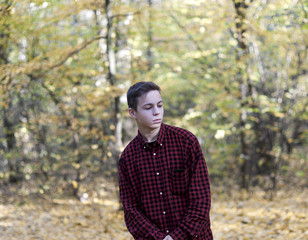 stylish young man in autumn park
