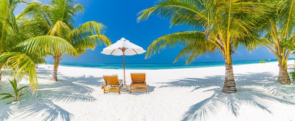 Vacation holidays background wallpaper romantic beach lounge chairs summer couple sand blue sky clouds sea relaxing sunshine design banner concept 2017 spring time nature vintage sky inspiration mood © icemanphotos