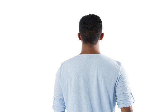 Man looking at invisible screen against white background