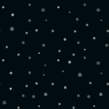A variety of snowflakes, light snowflakes of different forms on a dark background. Seamless vector pattern.