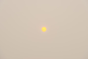 Autumn sun in a cloudy sky at fall