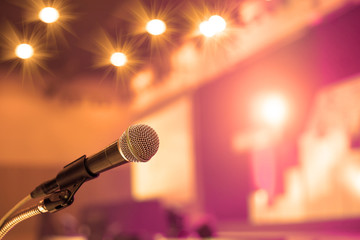 Microphone in the  conference hall or seminar room background. meeting room, seminar, event,...