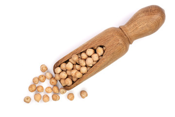 Dry raw organic chickpeas in a wooden scoop isolated on white background. Top view