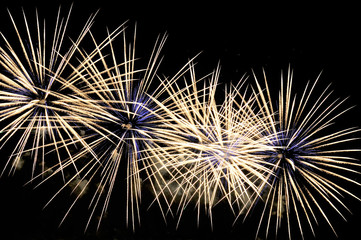 Obraz premium Amazing white-blue fireworks on black background