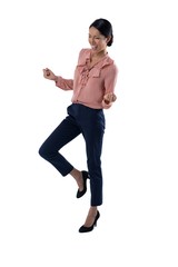 Female executive gesturing against white background