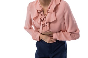 Female executive suffering from stomachache