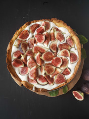 Fig tart on a black background