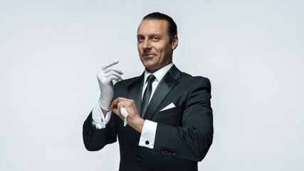 At Your service, well dressed man waiting for orders isolated on white background with copy space