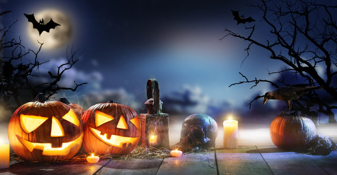 Spooky halloween pumpkins on wooden planks