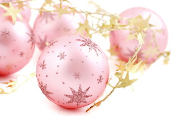 Christmas balls, pink on white background.