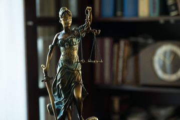 Law concept with Themis, symbol of justice.
