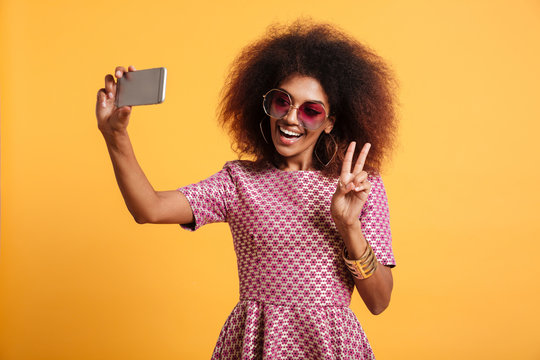 Portrait of a smiling afro american woman in retro style