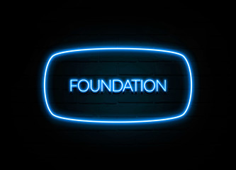Foundation  - colorful Neon Sign on brickwall