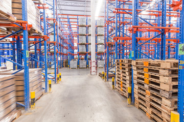 logistic, storage, shipment, industry and manufacturing concept - storing at warehouse shelves