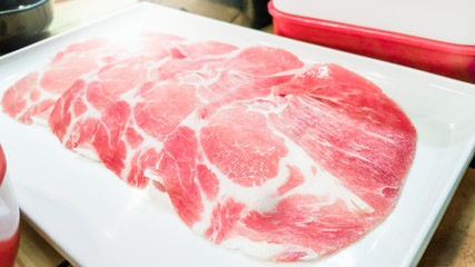 Fresh marinated pork and beef slices with ingredients for cooking grilled BBQ or shabu shabu and Sukiyaki Japanese food , Recommended dishes in Asian cuisine .