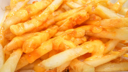 french fried potatoes on the table .