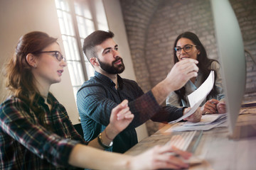 Group of young designers working as team