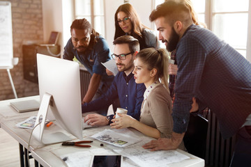 Group of young designers working as team