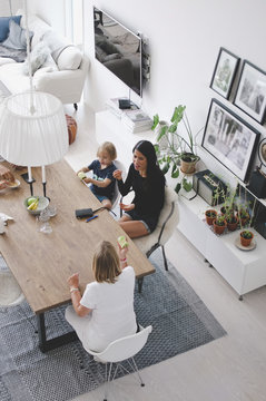 High angle view of multi generation family resting at table