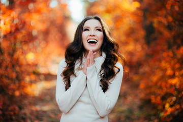Young sexy woman in the autumn forest