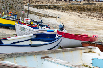 Fototapeta na wymiar Small colourful fishing boats on a quayside