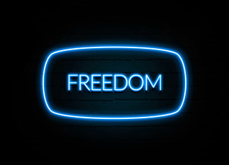 Freedom  - colorful Neon Sign on brickwall