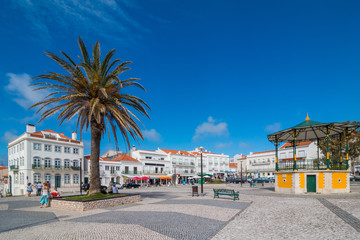 The central square of Nazare with pavilion and Nossa Senhora da Nazare Church on the background....