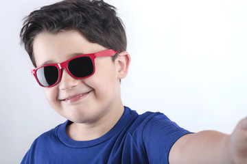 Smiling child taking selfie photo