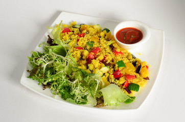 Сouscous with cheese paneer and vegetables with salad mix and tomato sauce