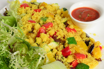 Сouscous with cheese paneer and vegetables with salad mix and tomato sauce