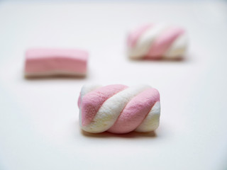 Fluffy pink white marshmallows, isolated on white background  