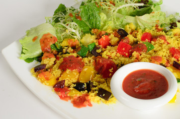Сouscous with cheese paneer and vegetables with salad mix and tomato sauce