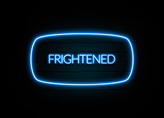 Frightened  - colorful Neon Sign on brickwall