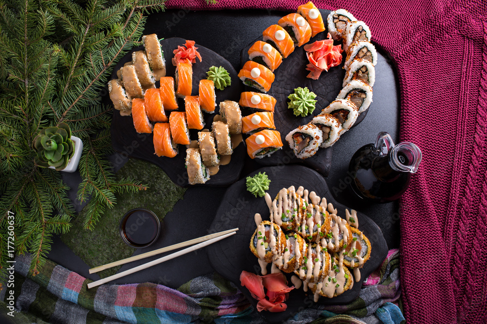 Wall mural christmas sushi delicious dish on dark table celebration new year