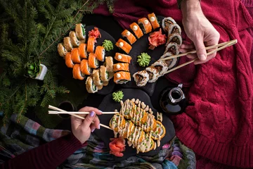 Foto op Plexiglas Christmas sushi delicious dish on dark table celebration new year  © skroxa