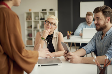 Multi ethnic group working in modern office